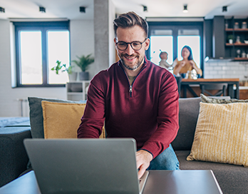 Man on Couch Searching for Commercial Lender